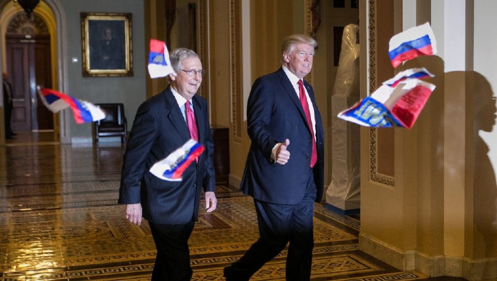 Protester throws Russian flags at President Donald Trump before Capitol Hill lunch